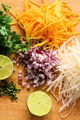 Frozen halibut steaks fried up beautifully for these fish tacos, and once wrapped in the tortilla, spread with a dab of sriracha-sour cream and topped with this tasty slaw, the fish becomes a second-string player. // alexandracooks.com