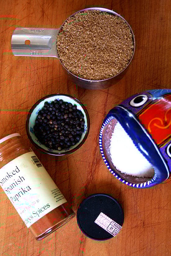 Overhead of 4 spices on wooden surface