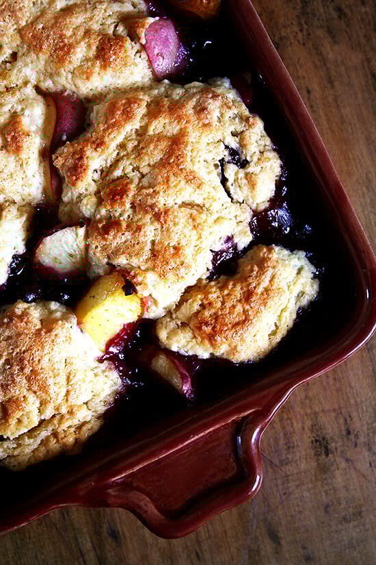 This peach blueberry cobbler is perfect for summer parties. With vanilla ice cream melting through each bite, smiles will abound. If you're needing to make a dessert for a crowd, look no further. This is it. Yum yum yum yum yum. // alexandracooks.com This peach blueberry cobbler is perfect for summer parties. With vanilla ice cream melting through each bite, smiles will abound. If you're needing to make a dessert for a crowd, look no further. This is it. Yum yum yum yum yum. // alexandracooks.com