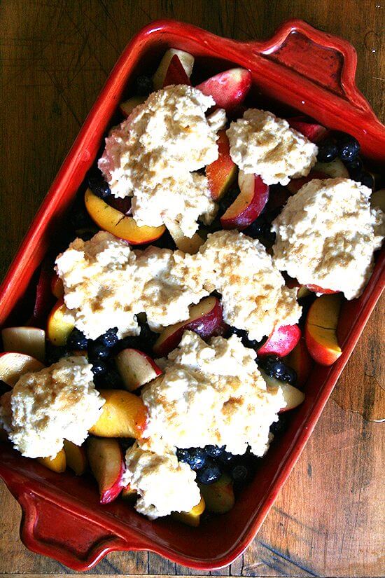 This peach blueberry cobbler is perfect for summer parties. With vanilla ice cream melting through each bite, smiles will abound. If you're needing to make a dessert for a crowd, look no further. This is it. Yum yum yum yum yum. // alexandracooks.com This peach blueberry cobbler is perfect for summer parties. With vanilla ice cream melting through each bite, smiles will abound. If you're needing to make a dessert for a crowd, look no further. This is it. Yum yum yum yum yum. // alexandracooks.com