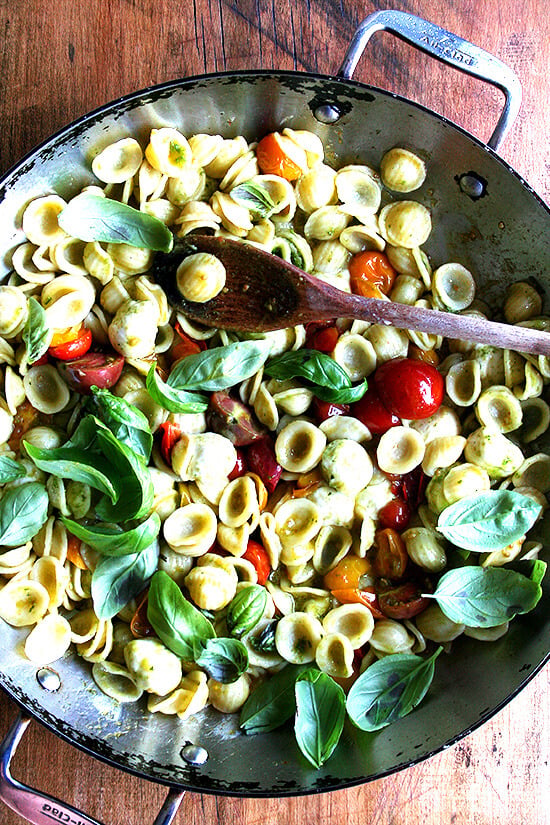 This summer pasta dish simple to prepare: Sauté cherry tomatoes with orecchiette, ciliegene mozzarella and basil pesto. Add some fresh basil just before plating along with some shavings of Parmigiano Reggiano and fresh cracked pepper. Yum yum yum. // alexandracooks.com This summer pasta dish simple to prepare: Sauté cherry tomatoes with orecchiette, ciliegene mozzarella and basil pesto. Add some fresh basil just before plating along with some shavings of Parmigiano Reggiano and fresh cracked pepper. Yum yum yum. // alexandracooks.com