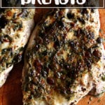 Broiled Tarragon Chicken Breasts on a board.