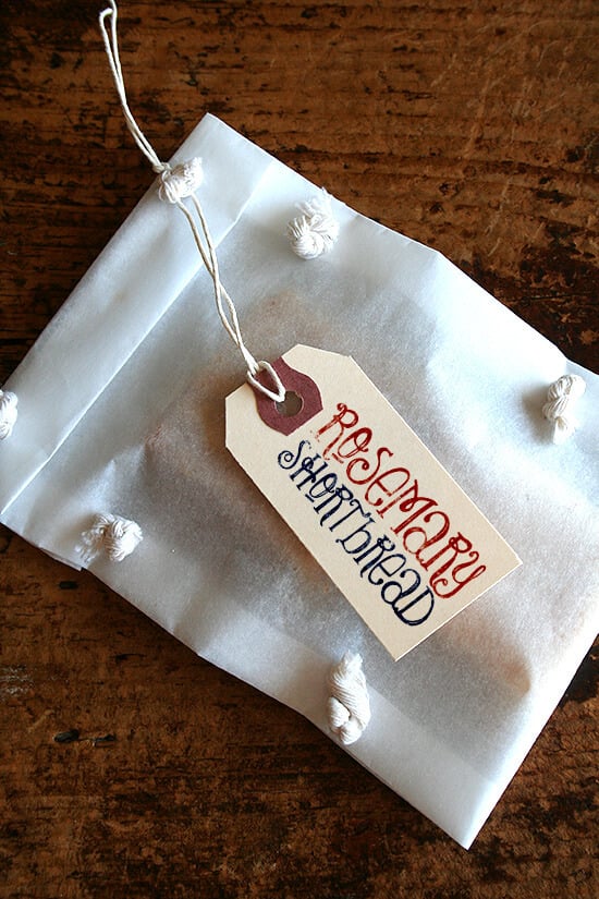 A package of rosemary shortbread with a decorative gift tag. 