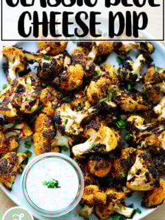 A large platter filled with buffalo cauliflower aside blue cheese dip.