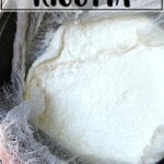 A bowl of ricotta straining in a sieve.