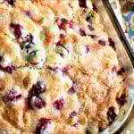 Just baked cranberry orange buttermilk breakfast cake in glass baking dish.