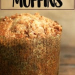 A coffeecake muffin on a board.