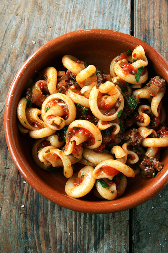 In this tomato sauce, canned tomatoes are brightened by olive oil and sautéed onions, a few cloves of crushed garlic, a little white wine, some chopped fresh parsley, and a pinch of crushed red pepper flakes. After about 20 minutes of simmering, it's done. And it's delicious. // alexandracooks.com In this tomato sauce, canned tomatoes are brightened by olive oil and sautéed onions, a few cloves of crushed garlic, a little white wine, some chopped fresh parsley, and a pinch of crushed red pepper flakes. After about 20 minutes of simmering, it's done. And it's delicious. // alexandracooks.com