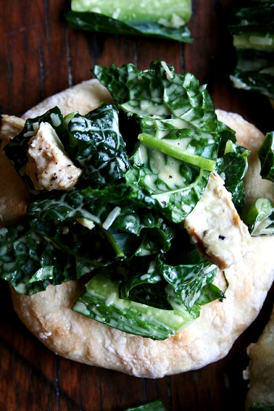 I'm planning a dinner party and thought it might be fun to make little flatbreads — "piadines" I saw them called — piled high with caesar salad — boring, I know, but perhaps made interesting by kale — tossed with sliced grilled chicken breasts — boring, I know, but chicken caesar kale salad is safe. I love this kind of thing, when bread and vegetable and meat are all wrapped up in one casual, fun, summery, light dish. // alexandracooks.com I'm planning a dinner party and thought it might be fun to make little flatbreads — "piadines" I saw them called — piled high with caesar salad — boring, I know, but perhaps made interesting by kale — tossed with sliced grilled chicken breasts — boring, I know, but chicken caesar kale salad is safe. I love this kind of thing, when bread and vegetable and meat are all wrapped up in one casual, fun, summery, light dish. // alexandracooks.com