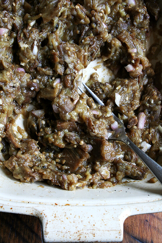 mashing the roasted eggplant mashing the roasted eggplant