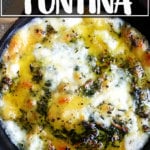 A skillet filled with baked fontina.