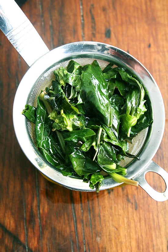 straining the basil oil