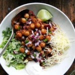 A bowl of chickpea taco bowls with toppings.