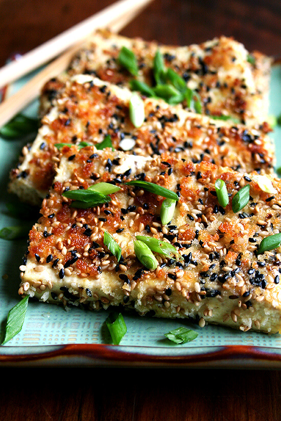 Sesame-crusted tofu on a platter.