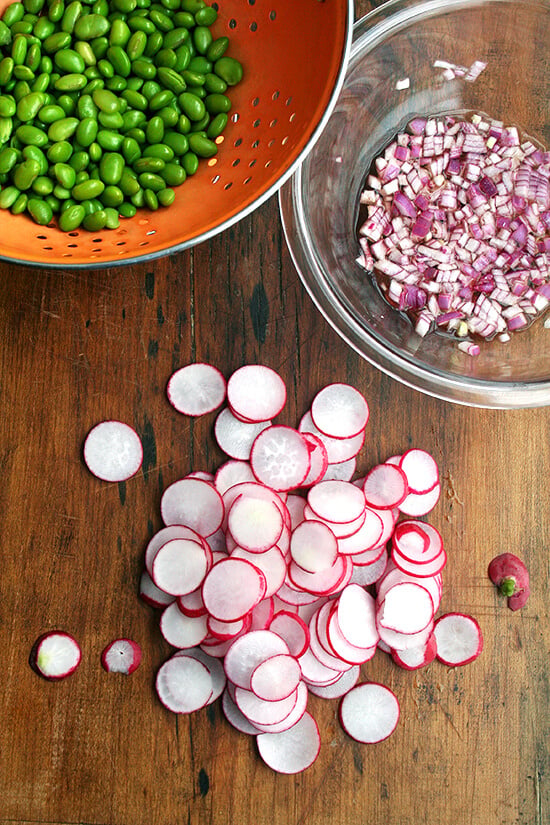 In this edamame and radish salad, radishes and edamame are in nearly equal proportion by volume, and the dressing is simple: equal parts olive oil and vinegar and a good sprinkling of salt โ both the radishes and the edamame can handle it. It's a cinch to throw together. High in protein, light, colorful, satisfying โ what's not to love here? And it's a great way to use up those CSA radishes to boot! // alexandracooks.com In this edamame and radish salad, radishes and edamame are in nearly equal proportion by volume, and the dressing is simple: equal parts olive oil and vinegar and a good sprinkling of salt โ both the radishes and the edamame can handle it. It's a cinch to throw together. High in protein, light, colorful, satisfying โ what's not to love here? And it's a great way to use up those CSA radishes to boot! // alexandracooks.com
