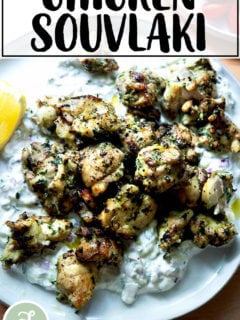 Chicken souvlaki on a plate with tzatziki.