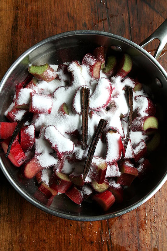 A sauce pan filled with rhubarb jam ingredients.