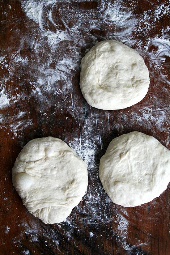 A board with three rounds of Lahey pizza dough.