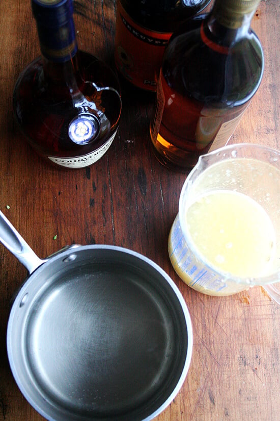 A pot aside ingredients for Fish House Punch.