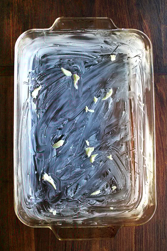 A 9x13-inch baking dish rubbed with butter and garlic.