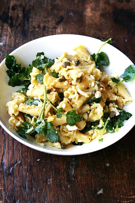 In this campanelle dish, a warm anchovy-caper-olive oil sauce dresses the pasta first; then a splash of lemon juice and reserved cooking liquid thin out the sauce ensuring it coats the pasta nicely; finally chopped hard-boiled eggs and greens complete the dish to make an impromptu, deeply satisfying dinner. // alexandracooks.com In this campanelle dish, a warm anchovy-caper-olive oil sauce dresses the pasta first; then a splash of lemon juice and reserved cooking liquid thin out the sauce ensuring it coats the pasta nicely; finally chopped hard-boiled eggs and greens complete the dish to make an impromptu, deeply satisfying dinner. // alexandracooks.com