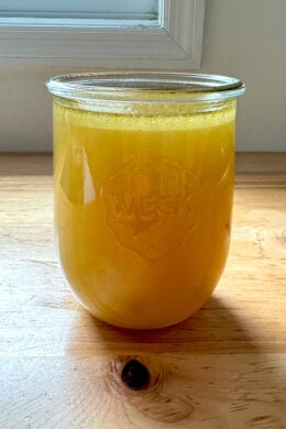 A Weck Jar filled with homemade chicken stock.