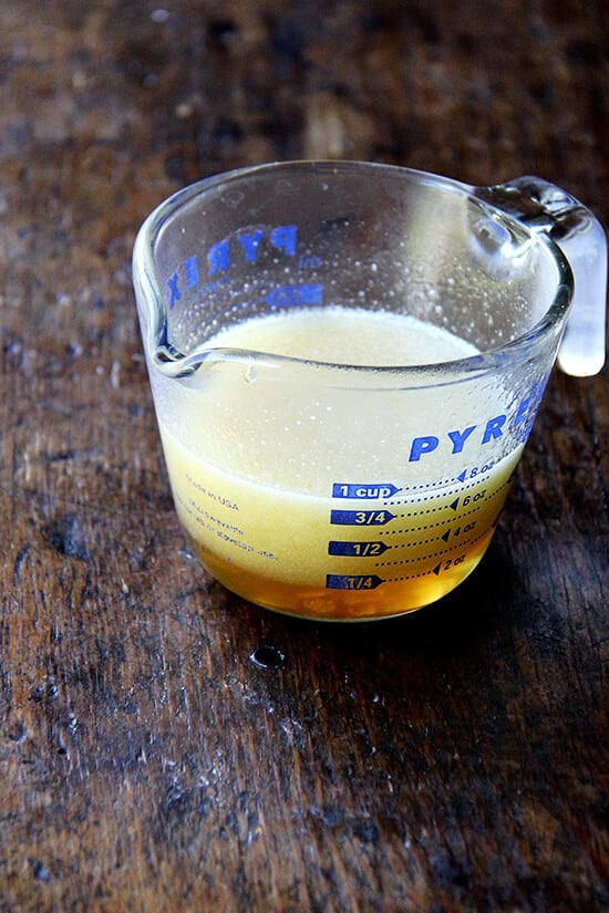 A liquid measuring cup filled with maple butter.