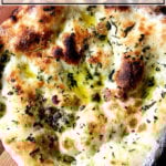 Herbed flatbread on a peel.