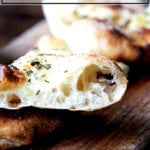 Herbed flatbread on a board.