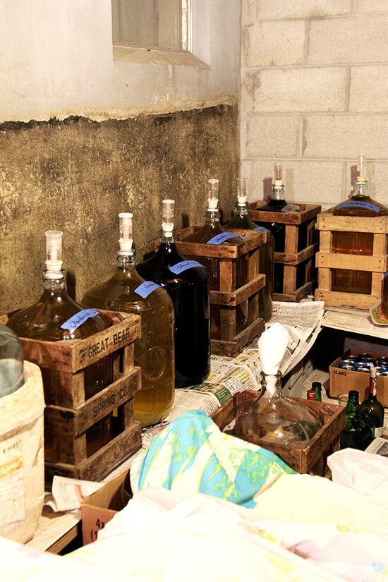 Large jugs of homemade wine lining the perimeter of Antonietta's basement.