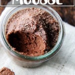 An overhead shot of glasses filled with chocolate mousse.