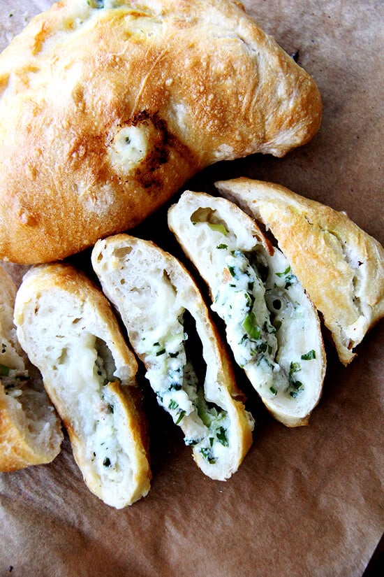 Before making this, I never would have described a calzone as light. Or as something that tastes like spring. Or as something I would consider serving to company, maybe sliced into rounds to reveal its oozing, cheesy goodness. This recipe changes all of that. // alexandracooks.com Before making this, I never would have described a calzone as light. Or as something that tastes like spring. Or as something I would consider serving to company, maybe sliced into rounds to reveal its oozing, cheesy goodness. This recipe changes all of that. // alexandracooks.com