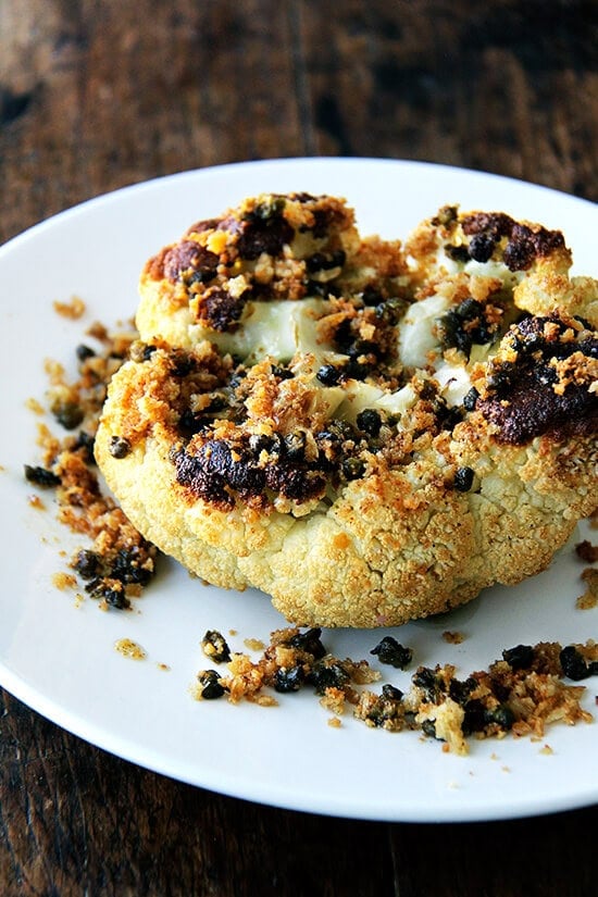 Minimal ingredients, minimal hands on time, this whole-roasted cauliflower with fried capers and brown butter breadcrumbs is a winner. The cauliflower emerges from the oven knife tender but not mushy. Here, the head's edges crisp and caramelize both from the heat of the oven and the oil pooling in the bottom of the pan, and the nutty crumbs and burst capers that nestle in the web of stems and spill all around the serving platter couldn't be more irresistible. // alexandracooks.com Minimal ingredients, minimal hands on time, this whole-roasted cauliflower with fried capers and brown butter breadcrumbs is a winner. The cauliflower emerges from the oven knife tender but not mushy. Here, the head's edges crisp and caramelize both from the heat of the oven and the oil pooling in the bottom of the pan, and the nutty crumbs and burst capers that nestle in the web of stems and spill all around the serving platter couldn't be more irresistible. // alexandracooks.com