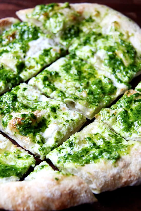 In this pesto pizza, while the pizza isn't baked completely naked, the process is similar: scatter cheese lightly across dough, drizzle it with olive oil and bake it until bubbling. Immediately upon pulling it from the oven, brush it with a thinned-out ramp pesto and a sprinkling of sea salt. Withholding the pesto from the pizza until it's out of the oven preserves not only its sharp, punchy flavor but also its vibrant green color. // alexandracooks.com In this pesto pizza, while the pizza isn't baked completely naked, the process is similar: scatter cheese lightly across dough, drizzle it with olive oil and bake it until bubbling. Immediately upon pulling it from the oven, brush it with a thinned-out ramp pesto and a sprinkling of sea salt. Withholding the pesto from the pizza until it's out of the oven preserves not only its sharp, punchy flavor but also its vibrant green color. // alexandracooks.com