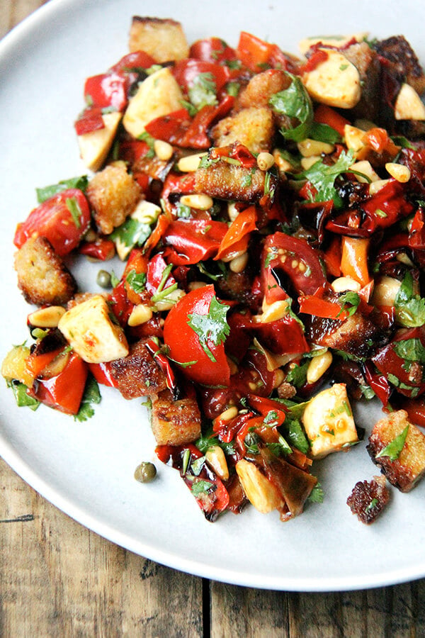 Folded into olive oil-fried bread, this magic peppers salad made a lovely panzanella salad but could have easily become a bruschetta or simple grain or pasta salad. Much to my delight, making this panzanella felt nothing like hard work. It was almost as though the salad assembled itself. Perhaps "hard work" is a state of mind. Hmm...deep thoughts. // alexandracooks.com Folded into olive oil-fried bread, this magic peppers salad made a lovely panzanella salad but could have easily become a bruschetta or simple grain or pasta salad. Much to my delight, making this panzanella felt nothing like hard work. It was almost as though the salad assembled itself. Perhaps "hard work" is a state of mind. Hmm...deep thoughts. // alexandracooks.com