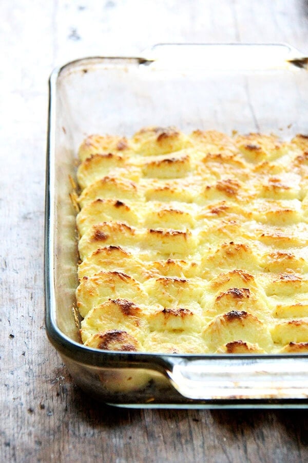 Made with milk, semolina flour, parmesan and egg yolks, this baked semolina gnocchi bears little resemblance to potato gnocchi. They taste more like polenta in fact, but are lighter in texture. In addition to being incredibly delicious, the beauty of gnocchi alla Romana is that it can be completely assembled ahead of time — up to two days — and baked just before serving. // alexandracooks.com Made with milk, semolina flour, parmesan and egg yolks, this baked semolina gnocchi bears little resemblance to potato gnocchi. They taste more like polenta in fact, but are lighter in texture. In addition to being incredibly delicious, the beauty of gnocchi alla Romana is that it can be completely assembled ahead of time — up to two days — and baked just before serving. // alexandracooks.com