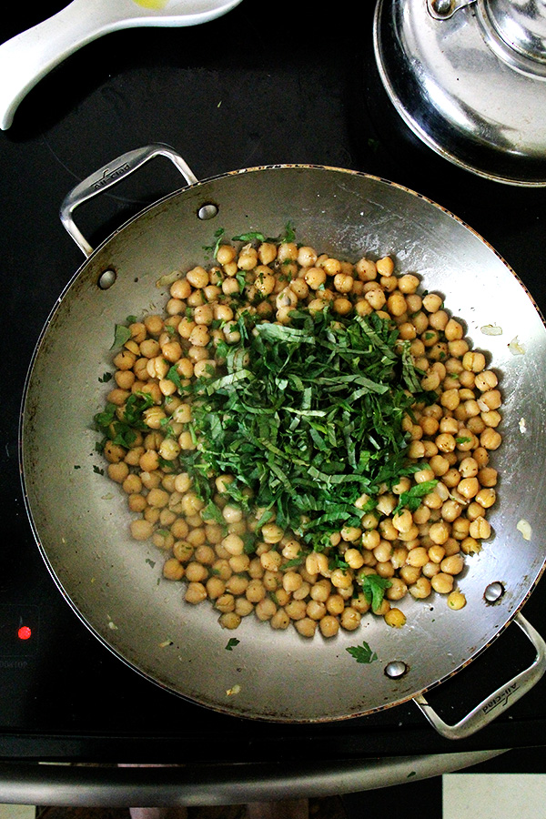 chickpeas and basil in pan