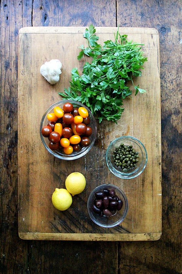 Sauce Nicoise ingredients on a board.