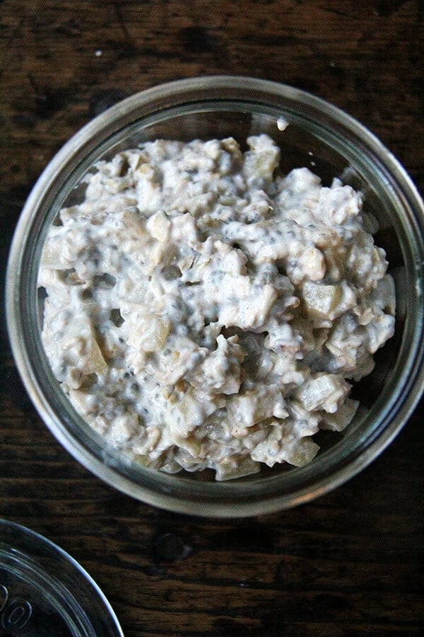 These apple pie overnight oats are a mix of rolled oats, almond milk, yogurt, chia seeds, and cubes of apples quickly sautéed with cinnamon and maple syrup. You mix it up at night (or 4 hours before you wish to eat them), and in the morning you awake to a hearty and completely delicious breakfast. It's a miracle. // alexandracooks.com A bowl of overnight oats with maple, apple, and cinnamon.