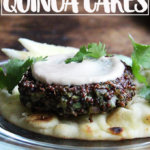 A plate topped with a crispy quinoa cake and tahini sauce.