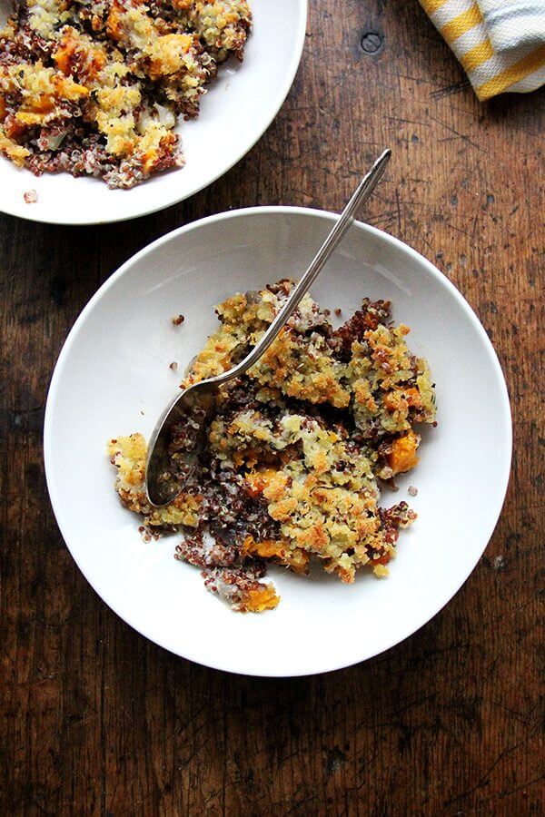 Quinoa bakes are new in my world, but this one surprised me with its familiarity and comfort. Simple, delicious, crowd-worthy. I like this combination: roasted onions and butternut squash, a mix of Gruyère and parmesan, and ALL the Thanksgiving herbs: sage, rosemary, and thyme. // alexandracooks.com A bowl of just-baked quinoa bake with roasted butternut squash and onions.