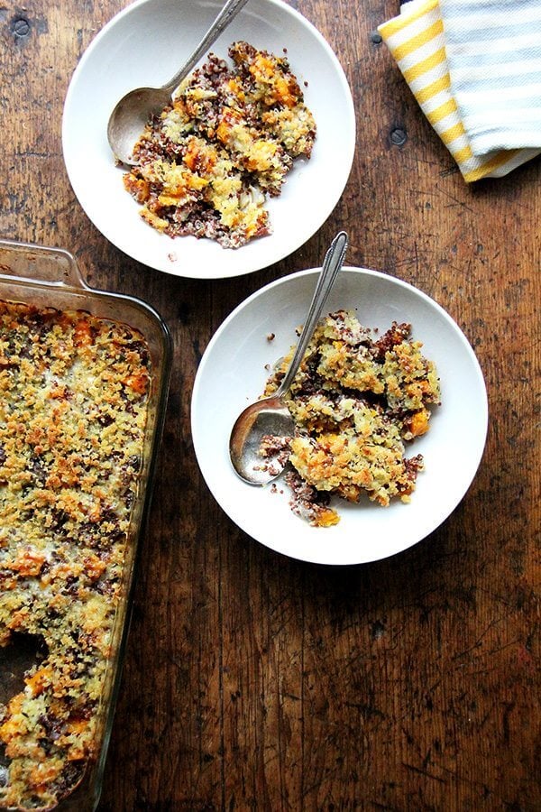 Quinoa bakes are new in my world, but this one surprised me with its familiarity and comfort. Simple, delicious, crowd-worthy. I like this combination: roasted onions and butternut squash, a mix of Gruyère and parmesan, and ALL the Thanksgiving herbs: sage, rosemary, and thyme. // alexandracooks.com Two bowls of roasted butternut squash and onion quinoa bake.