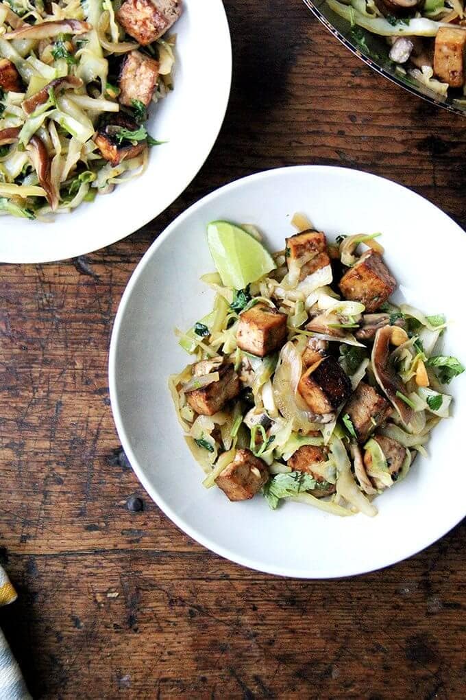 In this cabbage pad thai, sugar and lime juice in the stir-fry sauce stand in for tamarind, whose fruity, tart flavor lends that sweet-and-sourness characteristic of traditional pad Thai. This dish comes together quickly, and while the vegetables and seasonings may be unorthodox, the combination is tasty and satisfying. // alexandracooks.com In this cabbage pad thai, sugar and lime juice in the stir-fry sauce stand in for tamarind, whose fruity, tart flavor lends that sweet-and-sourness characteristic of traditional pad Thai. This dish comes together quickly, and while the vegetables and seasonings may be unorthodox, the combination is tasty and satisfying. // alexandracooks.com