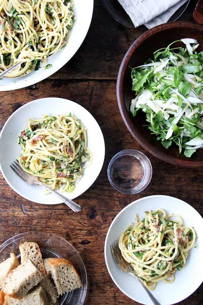 If you're looking for something to make for Valentine's Day, this bucatini carbonara couldn't be simpler to throw together: cook bacon, reserve the fat, use the fat to cook leeks; boil pasta, toss with eggs, fresh lemon juice, grated parmesan, and a little bit of pasta cooking liquid. Toss it all together, add some fresh parsley, and serve with more parmesan and lots of pepper. That's it! // alexandracooks.com If you're looking for something to make for Valentine's Day, this bucatini carbonara couldn't be simpler to throw together: cook bacon, reserve the fat, use the fat to cook leeks; boil pasta, toss with eggs, fresh lemon juice, grated parmesan, and a little bit of pasta cooking liquid. Toss it all together, add some fresh parsley, and serve with more parmesan and lots of pepper. That's it! // alexandracooks.com