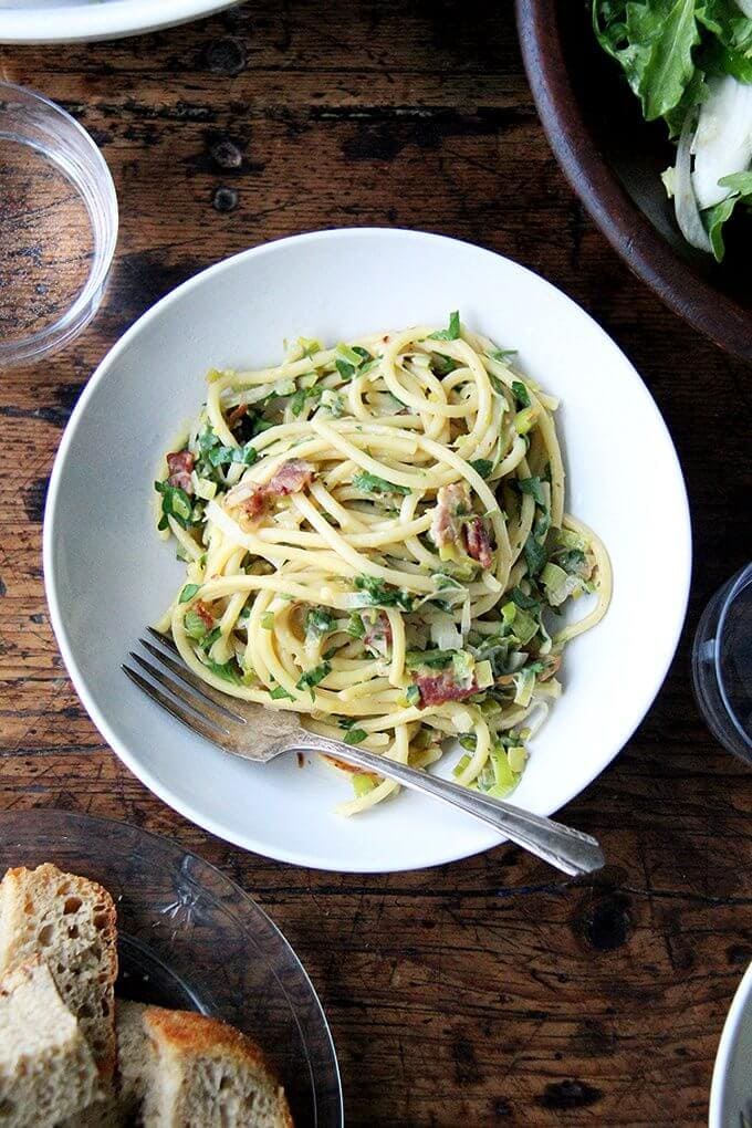 If you're looking for something to make for Valentine's Day, this bucatini carbonara couldn't be simpler to throw together: cook bacon, reserve the fat, use the fat to cook leeks; boil pasta, toss with eggs, fresh lemon juice, grated parmesan, and a little bit of pasta cooking liquid. Toss it all together, add some fresh parsley, and serve with more parmesan and lots of pepper. That's it! // alexandracooks.com If you're looking for something to make for Valentine's Day, this bucatini carbonara couldn't be simpler to throw together: cook bacon, reserve the fat, use the fat to cook leeks; boil pasta, toss with eggs, fresh lemon juice, grated parmesan, and a little bit of pasta cooking liquid. Toss it all together, add some fresh parsley, and serve with more parmesan and lots of pepper. That's it! // alexandracooks.com