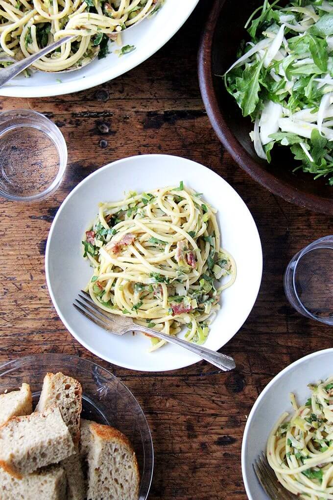 If you're looking for something to make for Valentine's Day, this bucatini carbonara couldn't be simpler to throw together: cook bacon, reserve the fat, use the fat to cook leeks; boil pasta, toss with eggs, fresh lemon juice, grated parmesan, and a little bit of pasta cooking liquid. Toss it all together, add some fresh parsley, and serve with more parmesan and lots of pepper. That's it! // alexandracooks.com If you're looking for something to make for Valentine's Day, this bucatini carbonara couldn't be simpler to throw together: cook bacon, reserve the fat, use the fat to cook leeks; boil pasta, toss with eggs, fresh lemon juice, grated parmesan, and a little bit of pasta cooking liquid. Toss it all together, add some fresh parsley, and serve with more parmesan and lots of pepper. That's it! // alexandracooks.com
