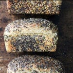 Three loaves of sprouted wheat sandwich bread.