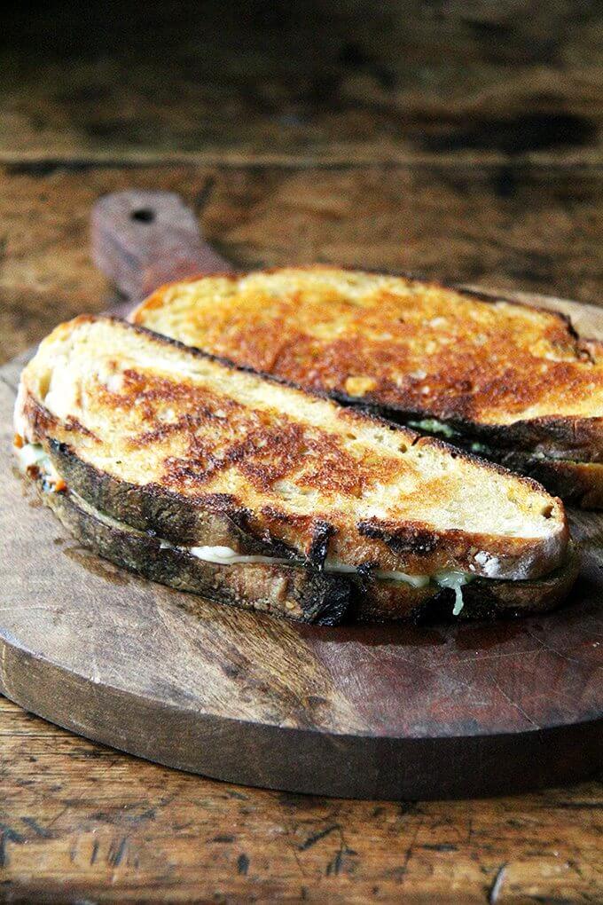 This ‘nduja grilled cheese includes Wisconsin fontina, a great melting cheese, and basil pesto, to offer a fresh counterpoint to the richness of the pâte-like spread. In keeping with the Italian theme, I sandwiched the three ingredients between thick slices of ciabatta, whose porous crumb so nicely absorbed the flavors of the spicy ‘nduja and sweet, earthy fontina. Yum. // alexandracooks.com This ‘nduja grilled cheese includes Wisconsin fontina, a great melting cheese, and basil pesto, to offer a fresh counterpoint to the richness of the pâte-like spread. In keeping with the Italian theme, I sandwiched the three ingredients between thick slices of ciabatta, whose porous crumb so nicely absorbed the flavors of the spicy ‘nduja and sweet, earthy fontina. Yum. // alexandracooks.com