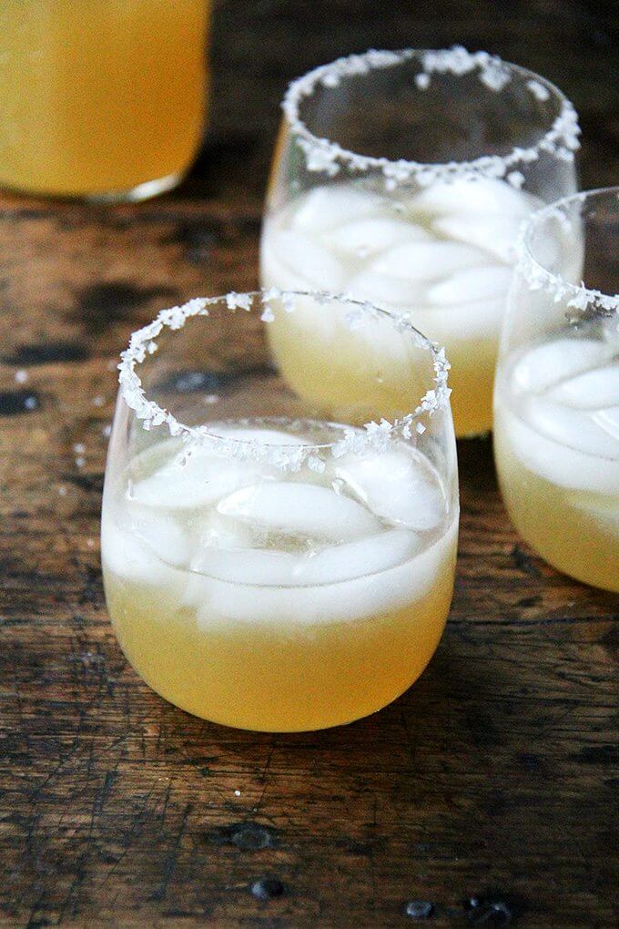I made this margarita recipe once many years ago now, and I've never looked back. While juicing the limes takes a bit of time, I think fresh lime juice is essential. I've quadrupled the recipe here, which yields four generous servings, perfect for an intimate Cinco De Mayo gathering. // alexandracooks.com Margaritas in salted-rim glasses.