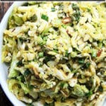 A bowl of Cabbage Slaw with Miso-Carrot Dressing.